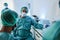 Medical scientist in hazmat suit working inside laboratory hospital - Focus on center face