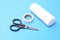 Medical set: a plaster, bandage scissors, isolated on a blue background.