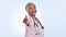 Medical, smile and thumbs up with an old woman nurse in studio on a blue background for support. Portrait, healthcare