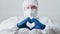 Medical specialist cardiologist ppe heart sign