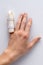 Medical splint on a broken finger, on a white background.