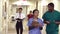 Medical Staff Along Hospital Corridor