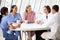 Medical Staff Chatting In Modern Hospital Canteen