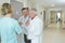 Medical staff conferring in hospital corridor