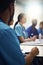 Medical Staff Meeting in Bright Conference Room with Blurred Figures