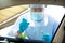 Medical staff with PPE suit testing patient at a Covid-19 drive thru by throat swab