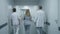 Medical staff walk along the modern clinic corridor