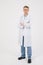 Medical staff. Young sympathetic doctor stands isolated on a white background dressed in a uniform for doctors