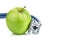 Medical stethoscope and apple on white