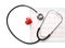 Medical stethoscope with cardiogram sheet on white background. Health care concept