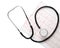 Medical stethoscope with cardiogram sheet on white background. Health care concept