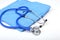 Medical stethoscope, Gloves, RX prescription on blue doctor uniform closeup. Medical tools and instruments shop, blood