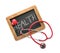 Medical stethoscope with heart and chalkboard on white background. Health care concept