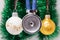 Medical stethoscope membrane anteriorly with two tubes surrounded by Christmas tree balls on blurred background with adornment. Co