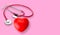 Medical stethoscope and red heart , heart check