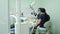 Medical Stomatology Concept. Doctor making teeth examination research survey using microscope in dentistry. Dentist is