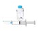 Medical syringe with blue needle and small glass vial of medicine vaccine