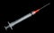 Medical Syringe And Needle Isolated On Black