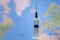 Medical syringe for a vaccine. World map background