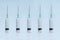 Medical syringes for the introduction of medicines. A device for vaccinating patients. Five syringes close up