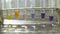 Medical test tubes in the laboratory with color liquid water in the laboratory with reagents on window with a marble