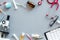 Medical tests on work table of doctor with microscope, cardiogram, test tube on gray background top view copyspace