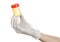 Medical theme: doctor\'s hand in white gloves holding a transparent container with the analysis of urine on a white background