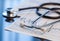 Medical tools. Stethoscope and cardiogram on a table.