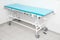 Medical trolley bed near wall