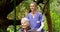 Medical, wheelchair and old woman and nurse in park for disability, retirement or Parkinson. Wellness, cancer and help