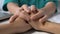 Medical worker comforting patient touching hands on table bad diagnosis, disease