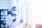 Medical worker, laboratory assistant holds test tubes with biomaterial in his hands