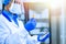 Medical worker, laboratory assistant holds test tubes with biomaterial in his hands