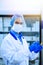 Medical worker, laboratory assistant holds test tubes with biomaterial in his hands