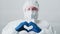 Medical worker nurse googles face mask heart sign