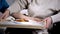 Medical worker serving tasty salad to old female patient, nursing home care