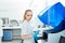 A medical worker works in an auto-biochemical and immune enzyme analyzer in the laboratory of the clinic.