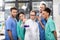 Medical workers analyzing test tube in laboratory