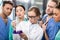 Medical workers analyzing test tube in laboratory