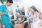 Medical workers argue with an elderly couple in a nursing home.