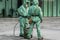 Medical workers in bio viral hazard protective suits disinfects street from coronavirus COVID-19. Antibacterial sanitary