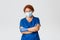 Medical workers, covid-19 pandemic, coronavirus concept. Professional redhead female doctor, physician or nurse in