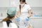 medical workers in dentistry decide and choose instrumen nurse asks teacher doctor woman showing printed sterile