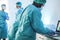 Medical workers in hazmat suit working with computer laptop  inside hospital lab during coronavirus outbreak