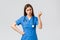 Medical workers, healthcare, covid-19 and vaccination concept. Angry and grumpy young female nurse, doctor scolding