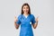 Medical workers, healthcare, covid-19 and vaccination concept. Enthusiastic and upbeat female nurse, doctor in blue