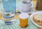 Medication during breakfast, capsules next to a glass of water, conceptual image