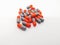 Medication and healthcare concept. Many gray-orange capsules of