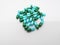 Medication and healthcare concept. Many green-blue capsules of A