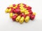 Medication and healthcare concept. Many red-yellow capsules of A